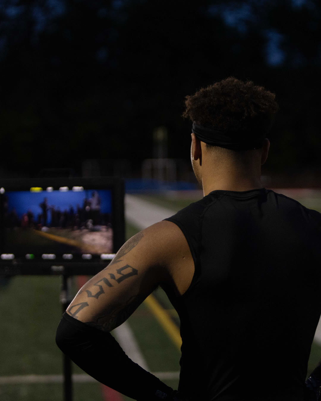 Brandon Inniss watches playback on a monitor at the night shoot.